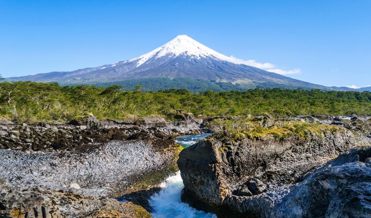 Petrohue waterfalls and volcano Osorno on background