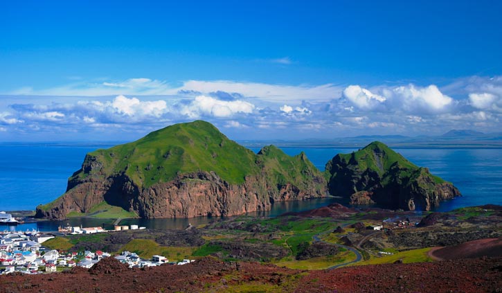 Heimaey-island-and-city-at-Vestmannaeyjar-archipelago,-Iceland-725-423--shutterstock_658919323